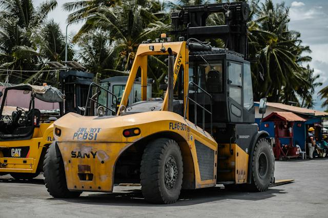 Heavy Equipment with palm trees in the background